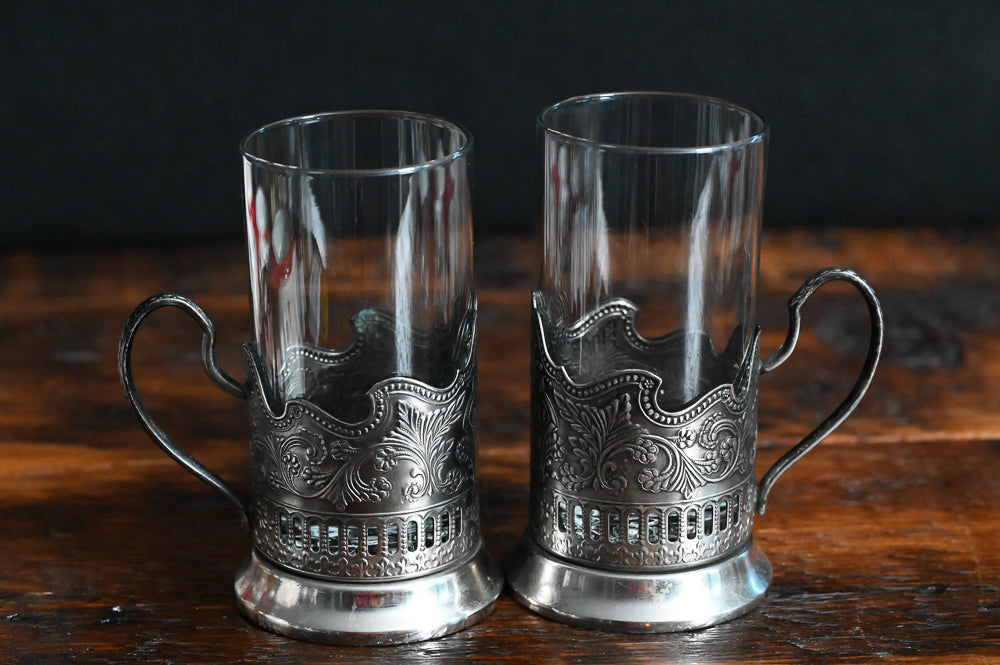 silver filigreed holder with handle and clear glass Russian tea glass