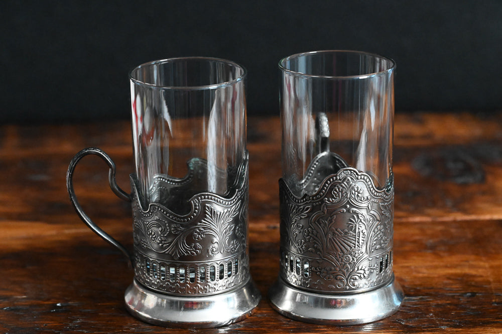 silver filigreed holder with handle and clear glass Russian tea glass