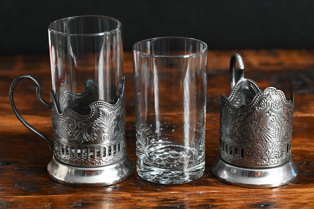 silver filigreed holder with handle and clear glass Russian tea glass