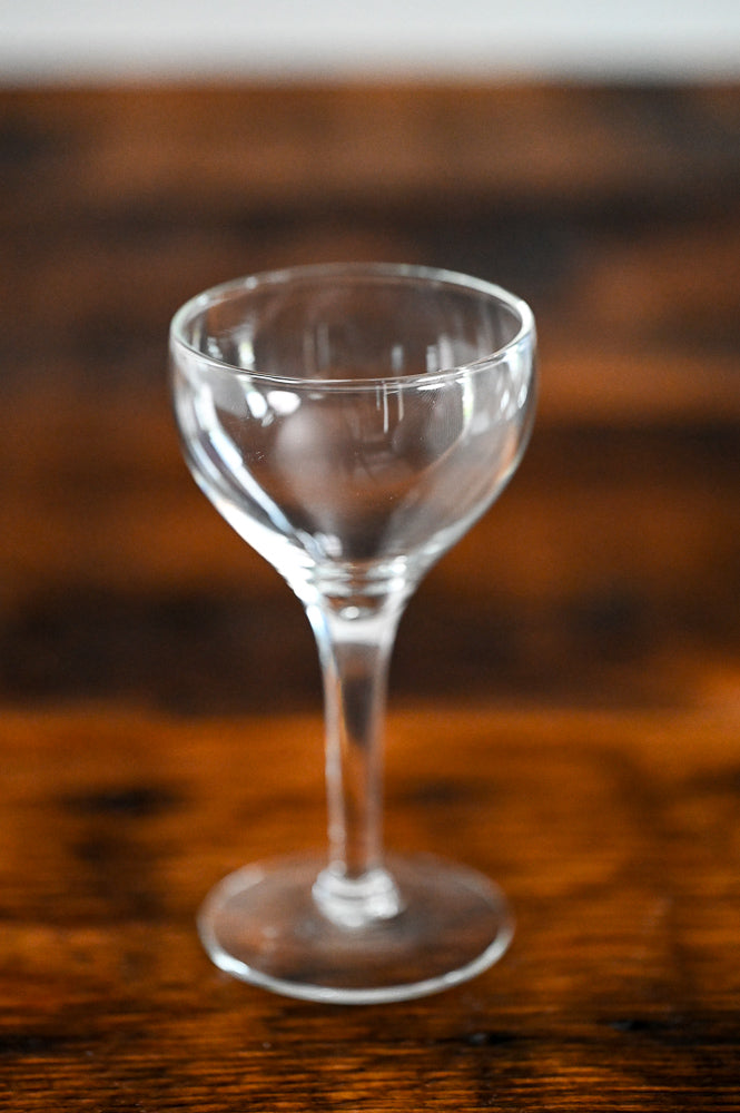 glass coupe on wood table