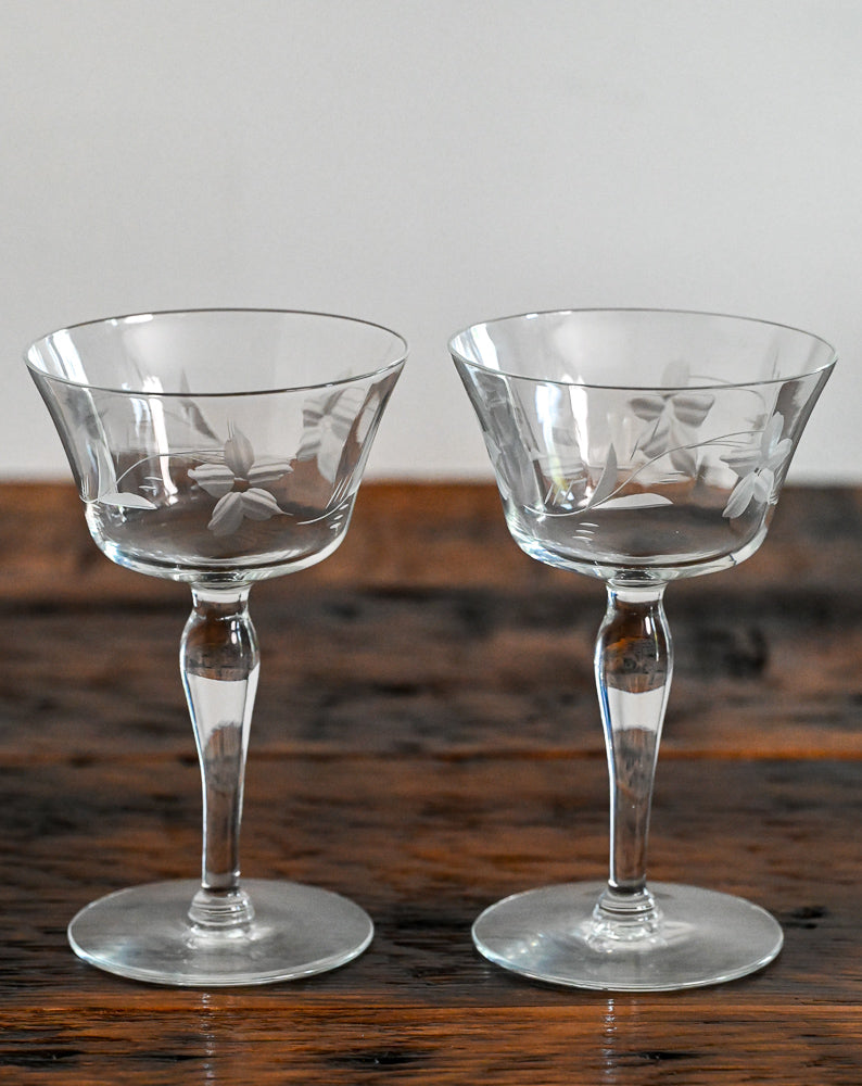 floral etched coupes on wood table