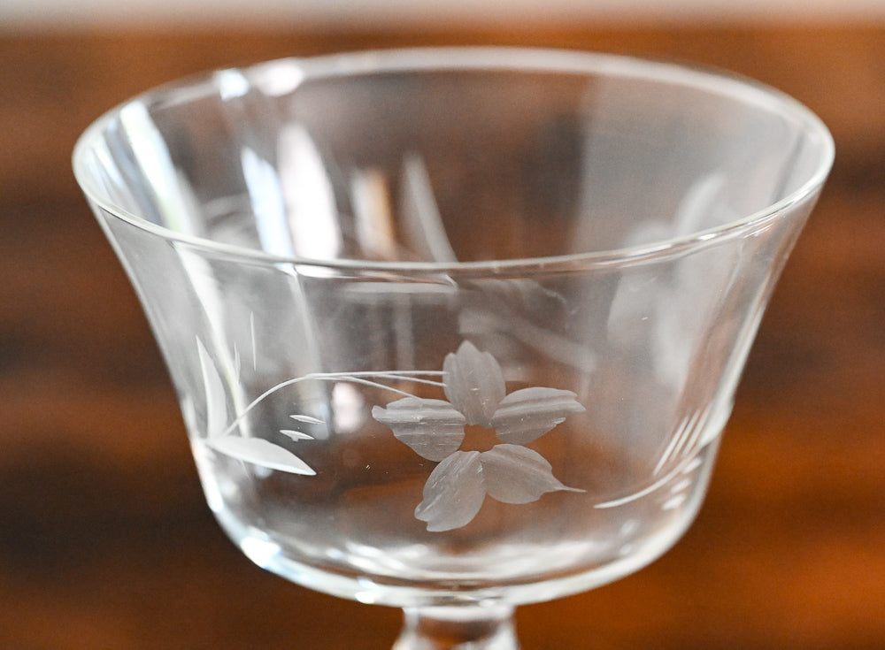 floral etched coupe on wood table