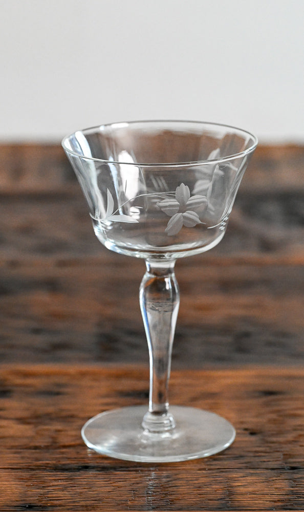 floral etched coupe on wood table