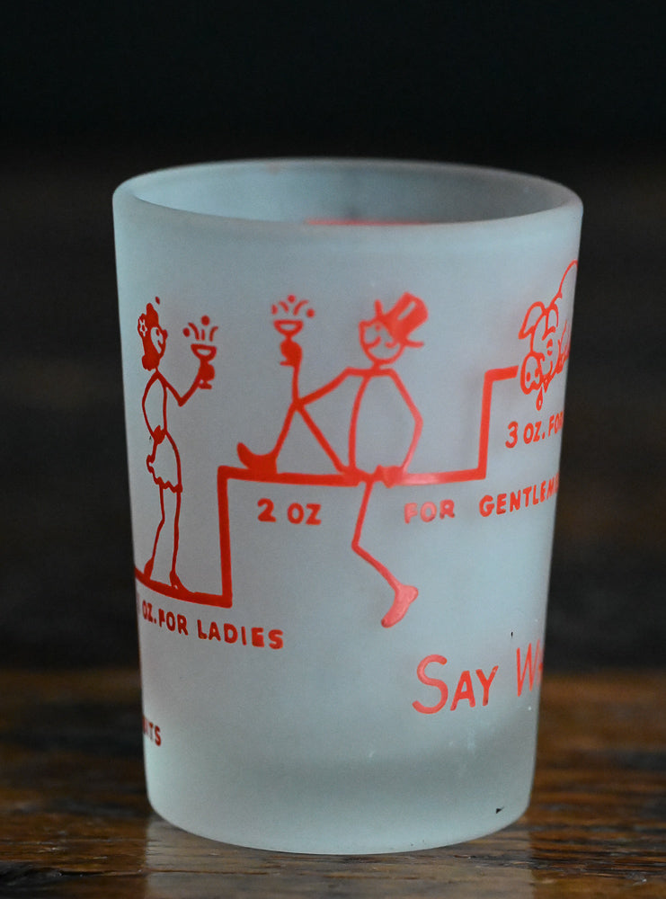 frosted Say When! shotglass with red writing and logos