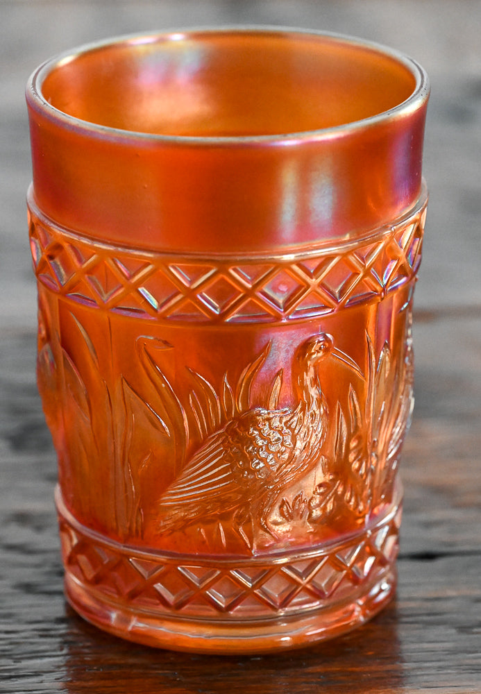 iridescent orange Carnival Glass stork tumblers