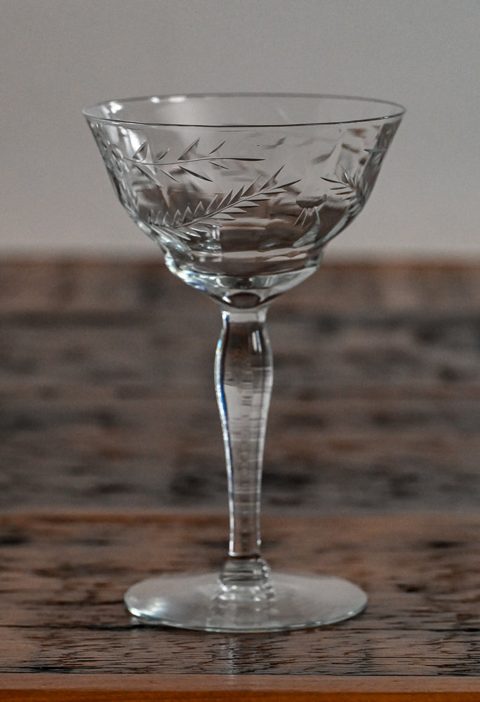floral etched coupe on wood table