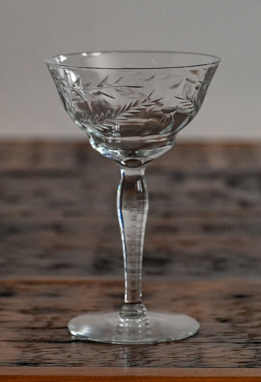 floral etched coupe on wood table