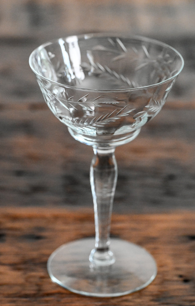 floral etched coupe on wood table