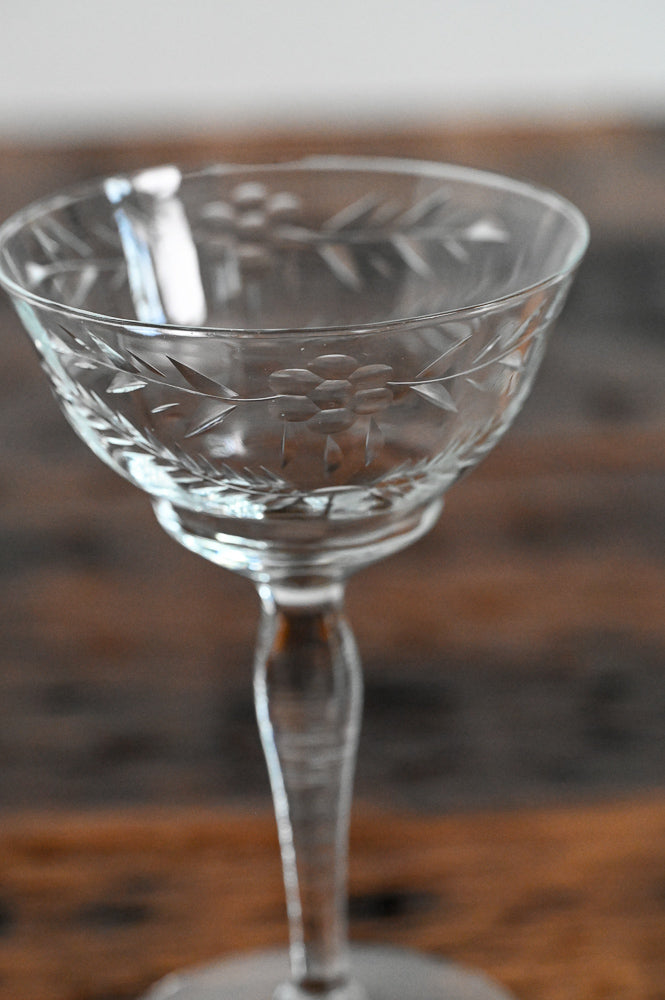 floral etched coupe on wood table