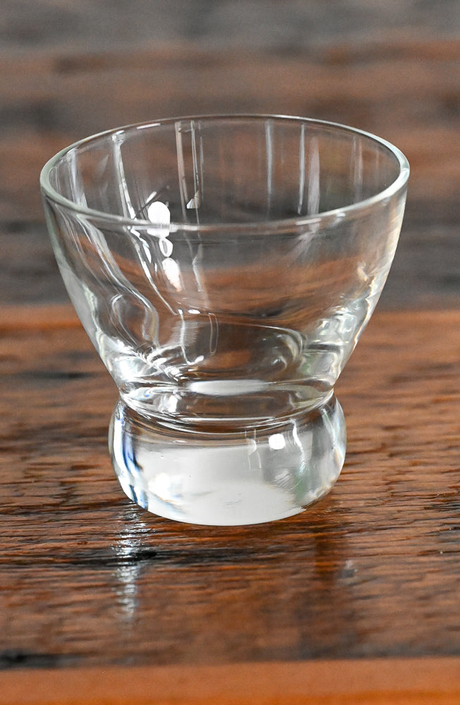 clear glass lowball on wood table