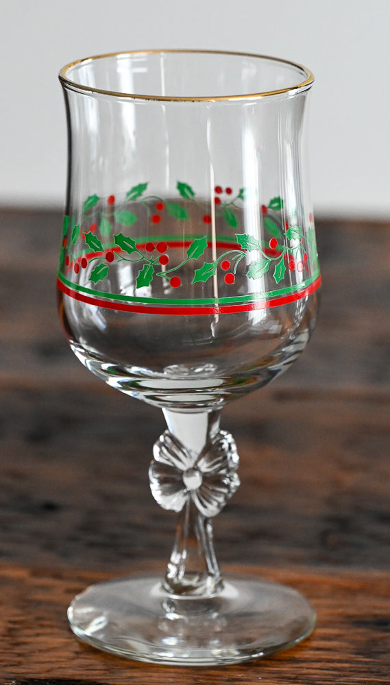 Libbey goblet with bow stem, green and red holly print, gold rim