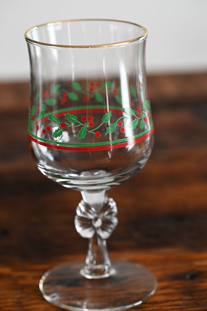 Libbey goblet with bow stem, green and red holly print, gold rim