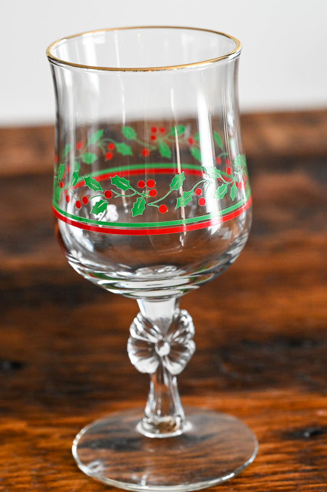 Libbey goblet with bow stem, green and red holly print, gold rim