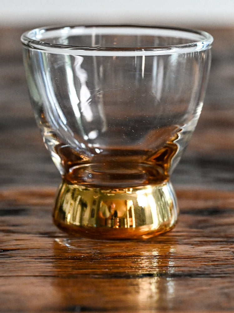 Clear lowball glass with gold bottom