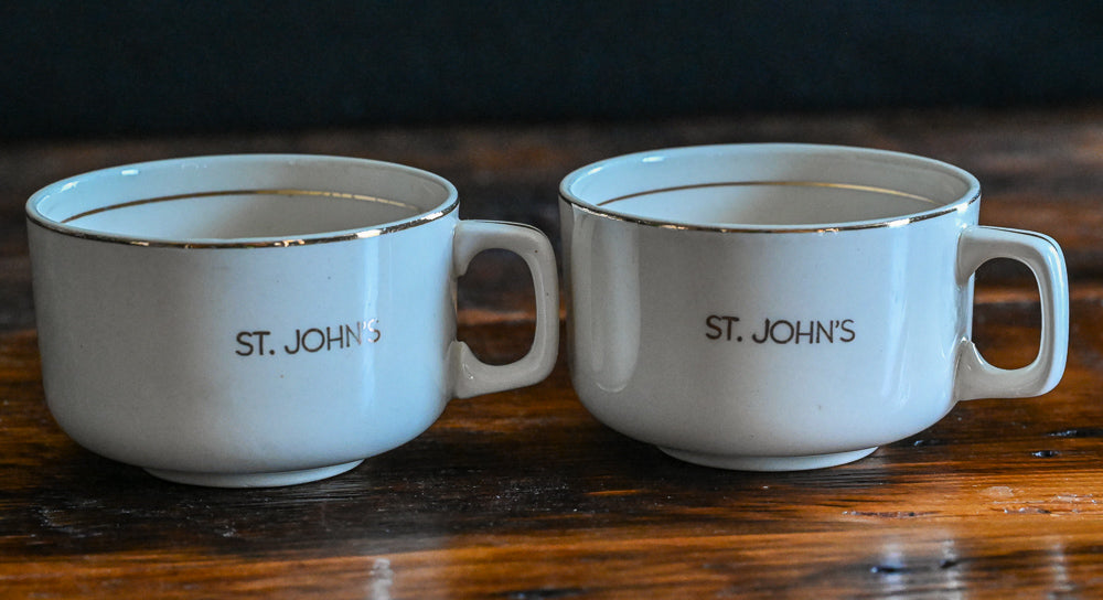 beige mugs with St John's in gold with gold rims