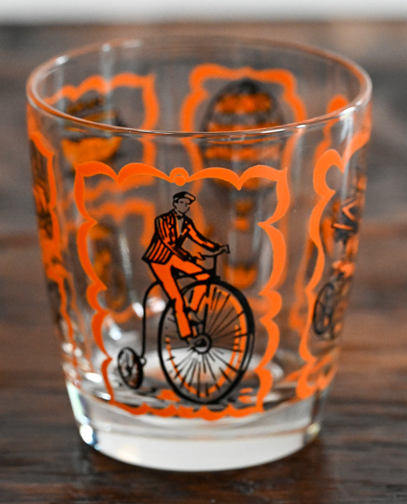 orange and black transportation print lowball glass