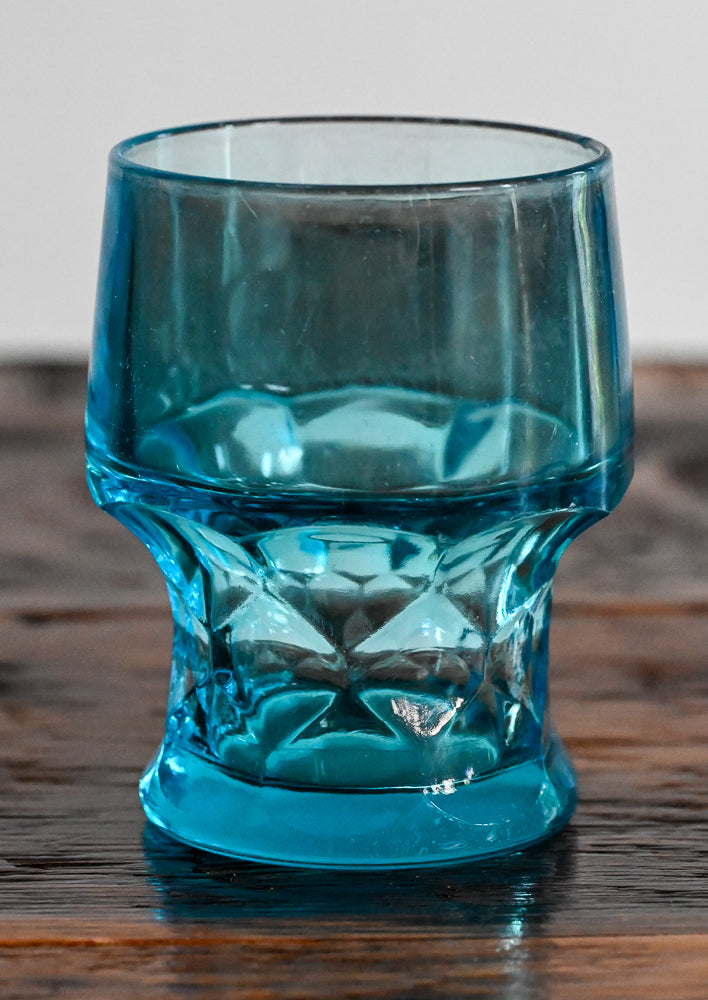 Blue tumbler on wooden table