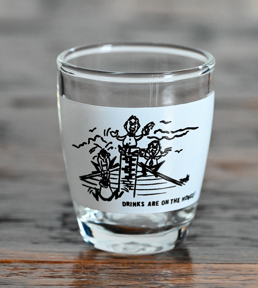 black and white print "Drinks are on the House" shot glass