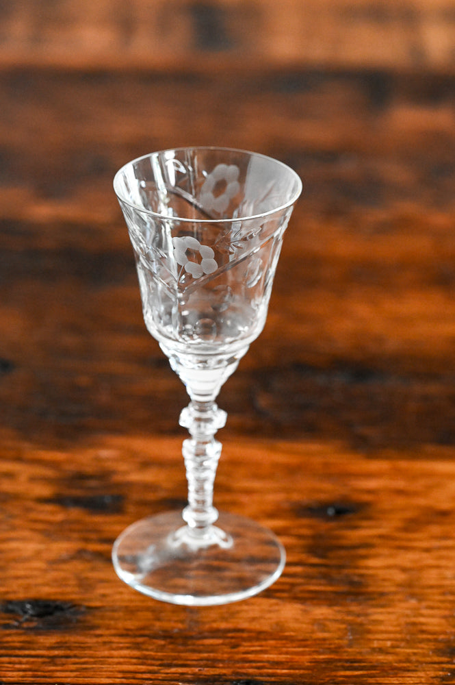 floral etched glass on wood table