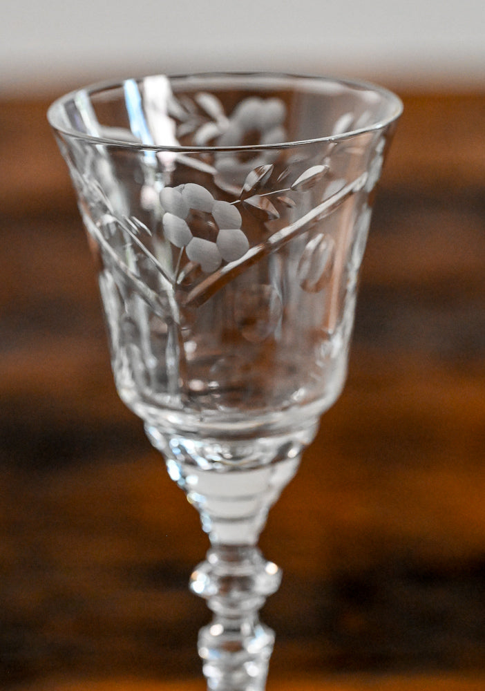 floral etched glass on wood table