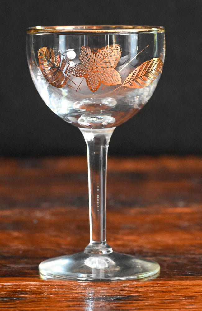 gold leaf and gold rim cocktail coupes