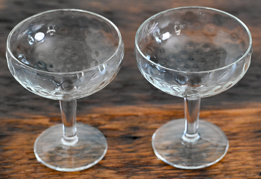 dimpled coupes on wood table