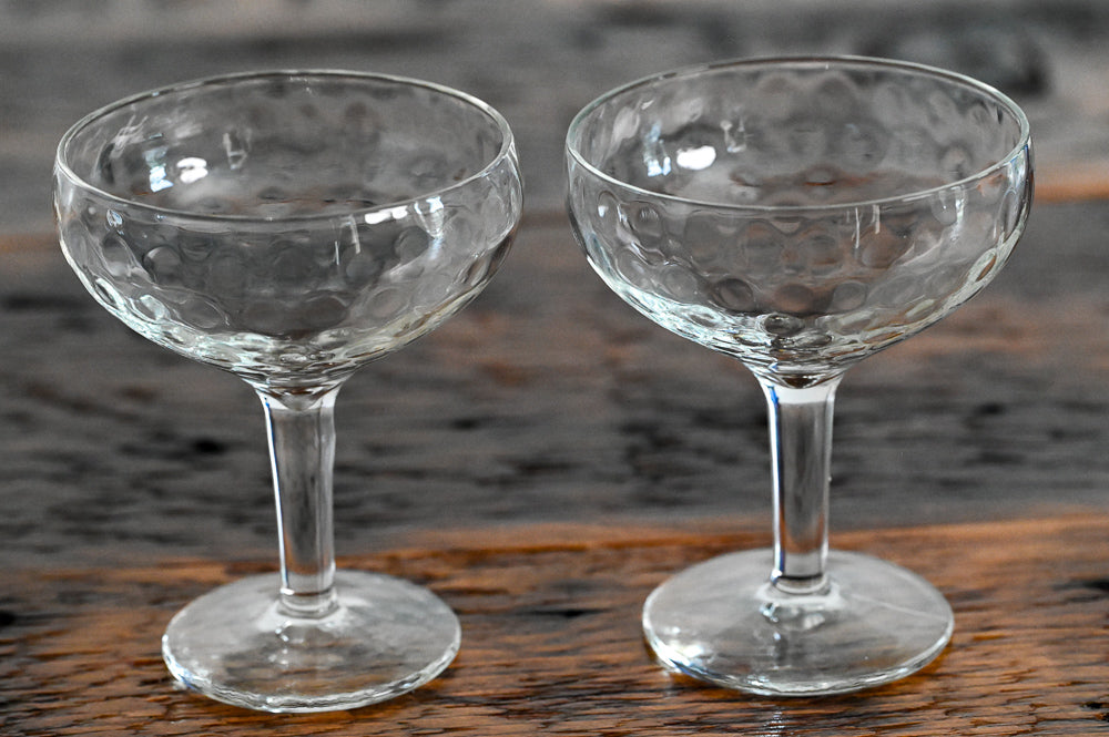dimpled coupes on wood table