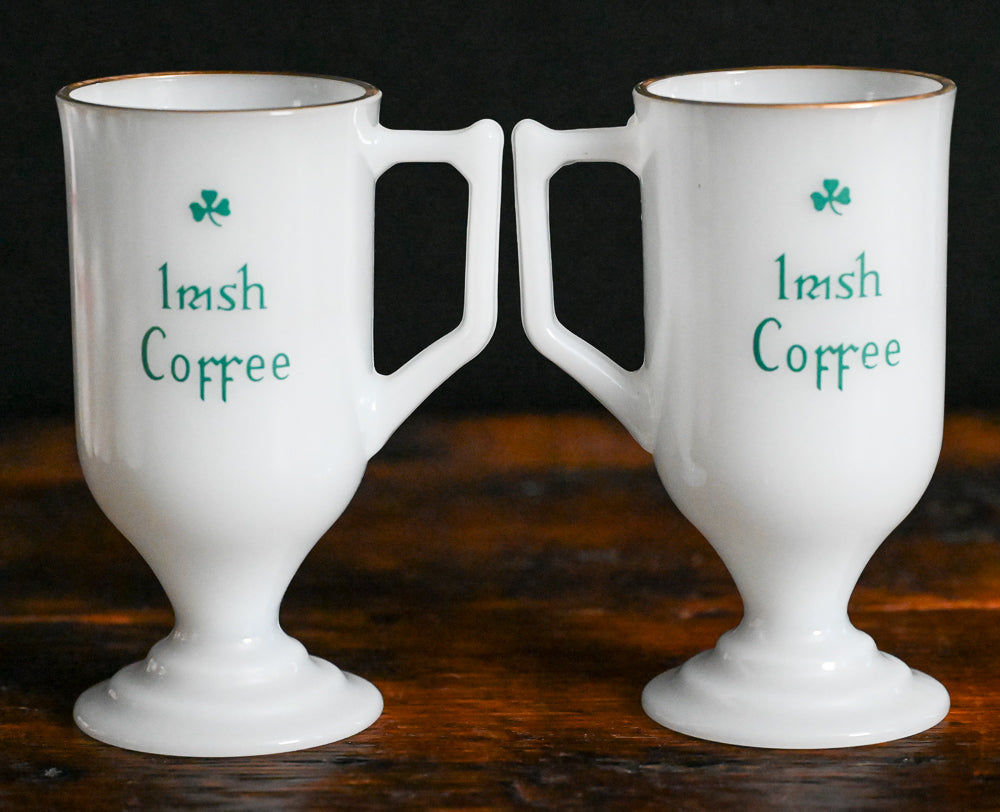 milk glass gold rim Irish coffee mug with green writing