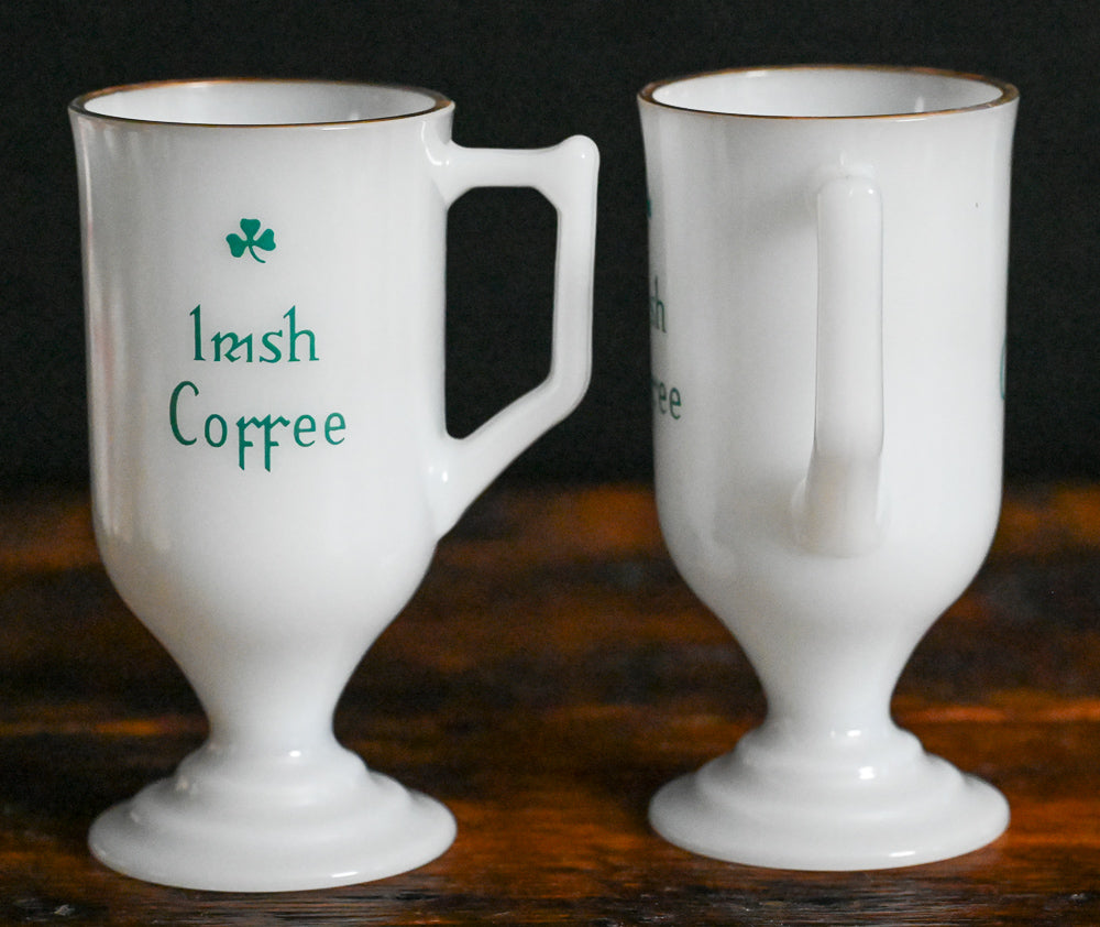 milk glass gold rim Irish coffee mug with green writing