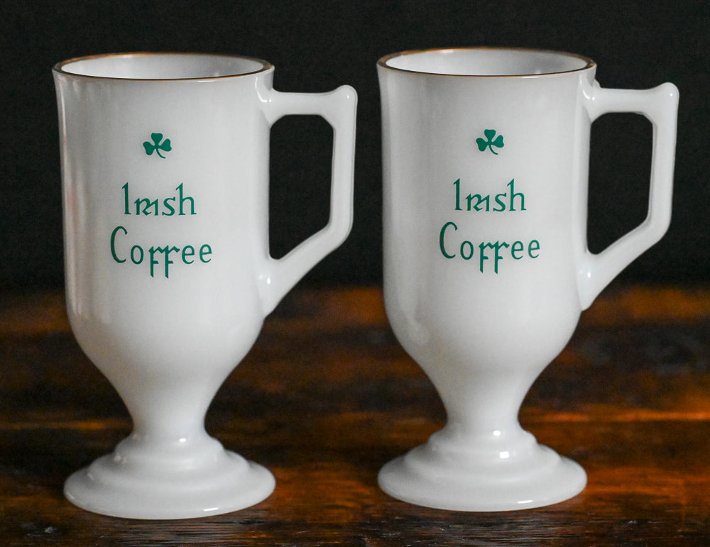 milk glass gold rim Irish coffee mug with green writing