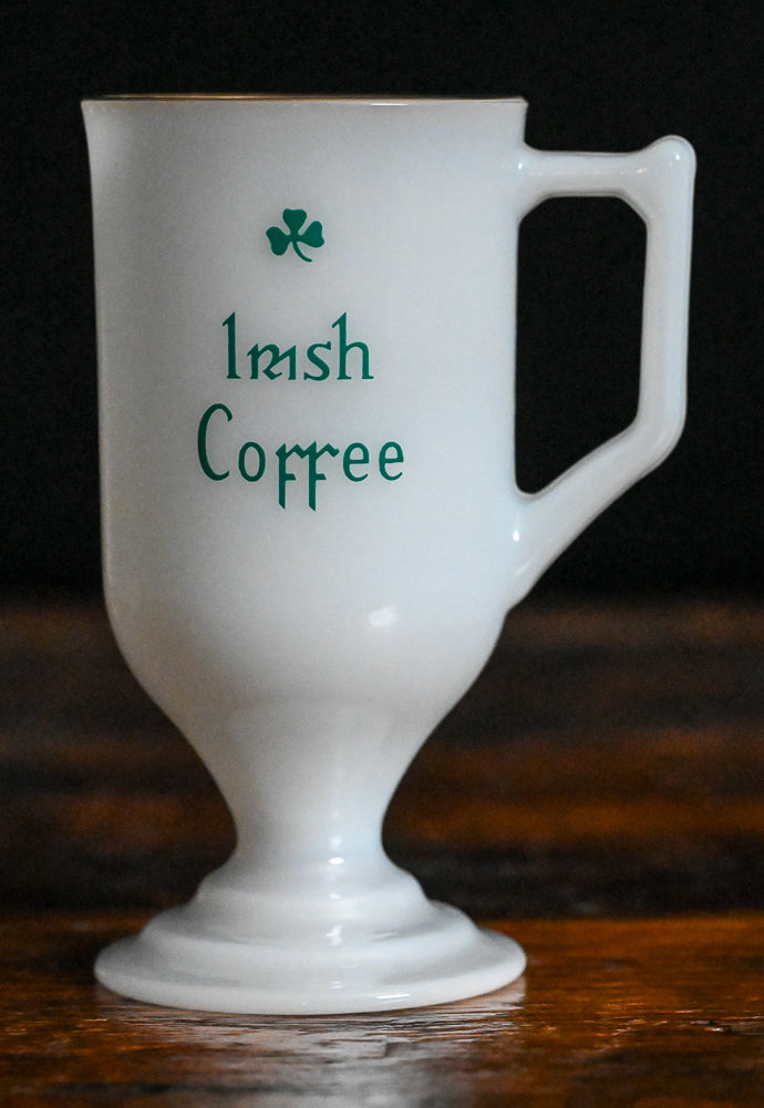 milk glass gold rim Irish coffee mug with green writing