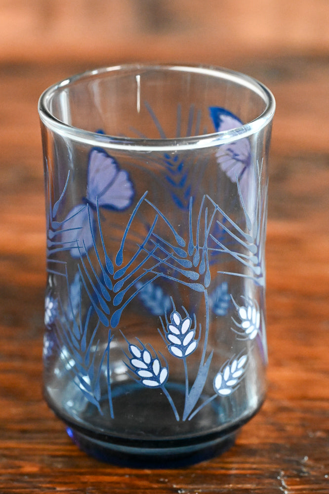 blue glass with butterfly and wheat print