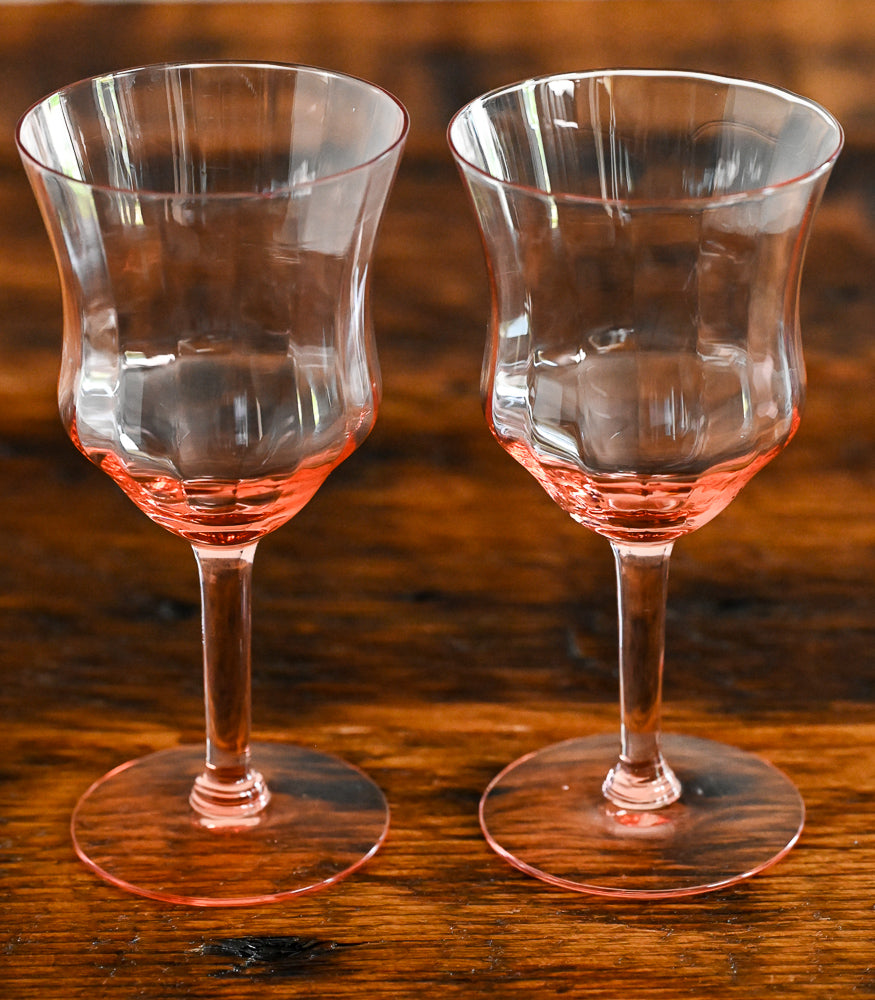 pink goblets on wood table