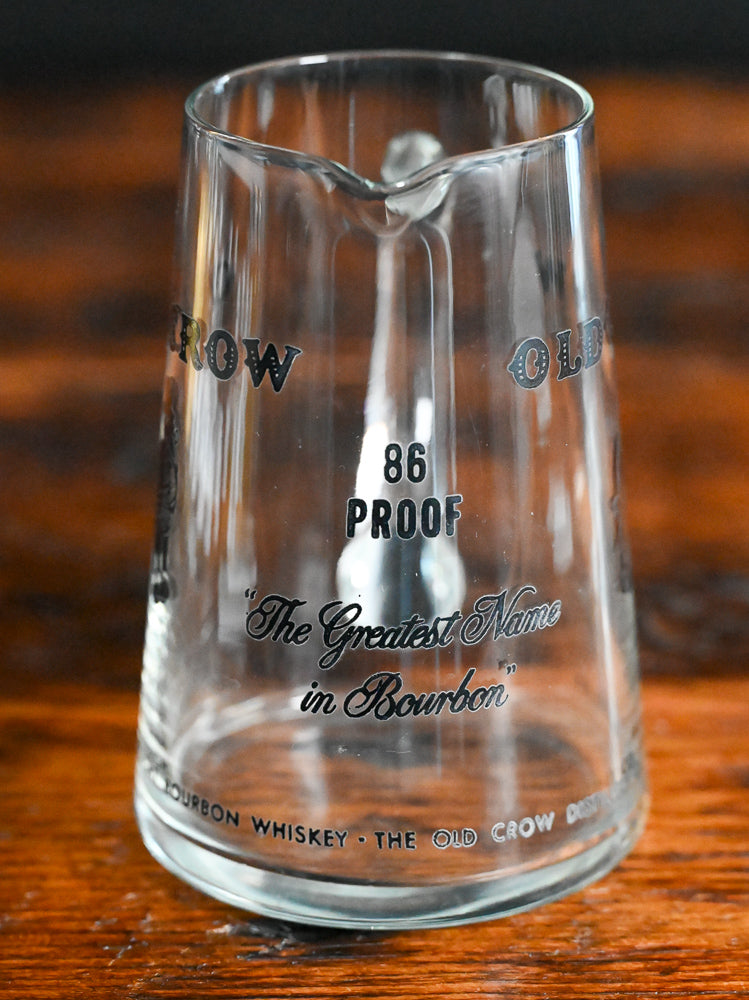 glass Old Crow pitcher with black writing and logo