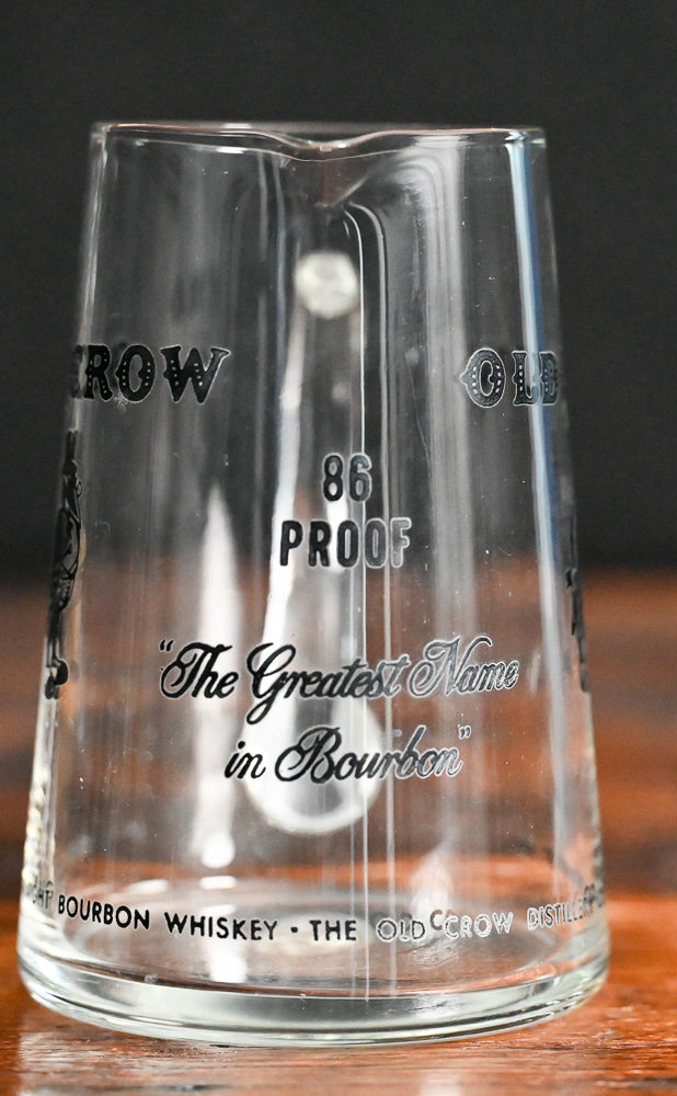 glass Old Crow pitcher with black writing and logo