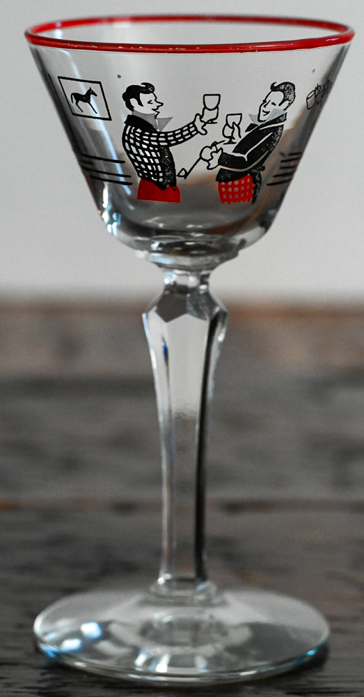 black and red scene of men drinking, red rim cocktail coupe