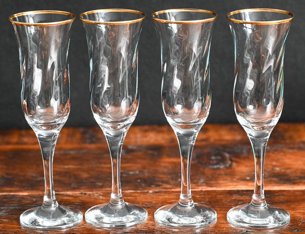 gold rim Maxim circleware champagne flutes