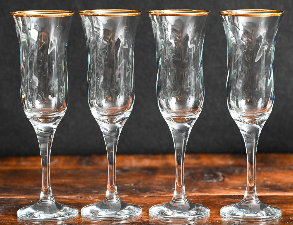gold rim Maxim circleware champagne flutes