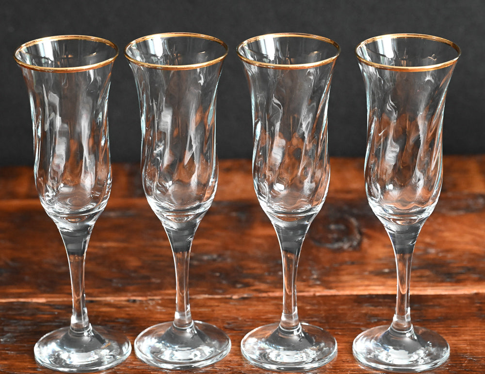 gold rim Maxim circleware champagne flutes