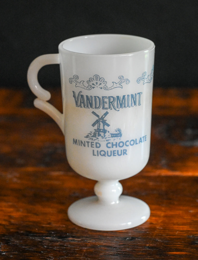 white milk glass Vandermint Mugs with blue writing and design