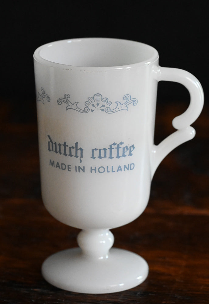 white milk glass Vandermint Mugs with blue writing and design