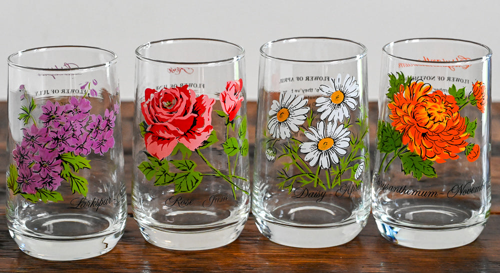 Flower of the month glasses on wooden table