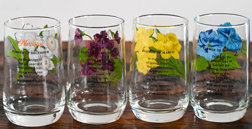 Flower of the month glasses on wooden table