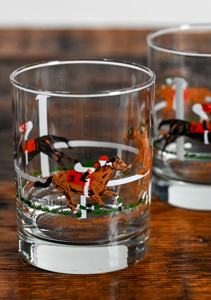 horses and jockeys rocks glass