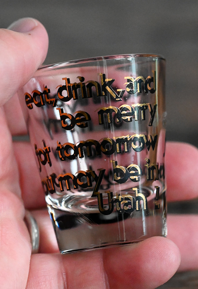 black and gold words on Utah shotglass