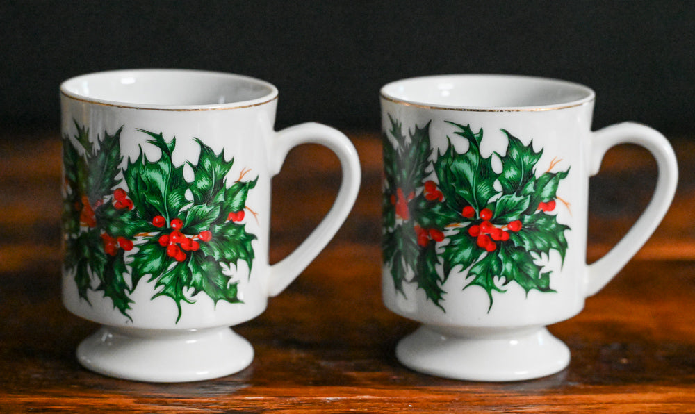white mug with gold rim and pointsettia print