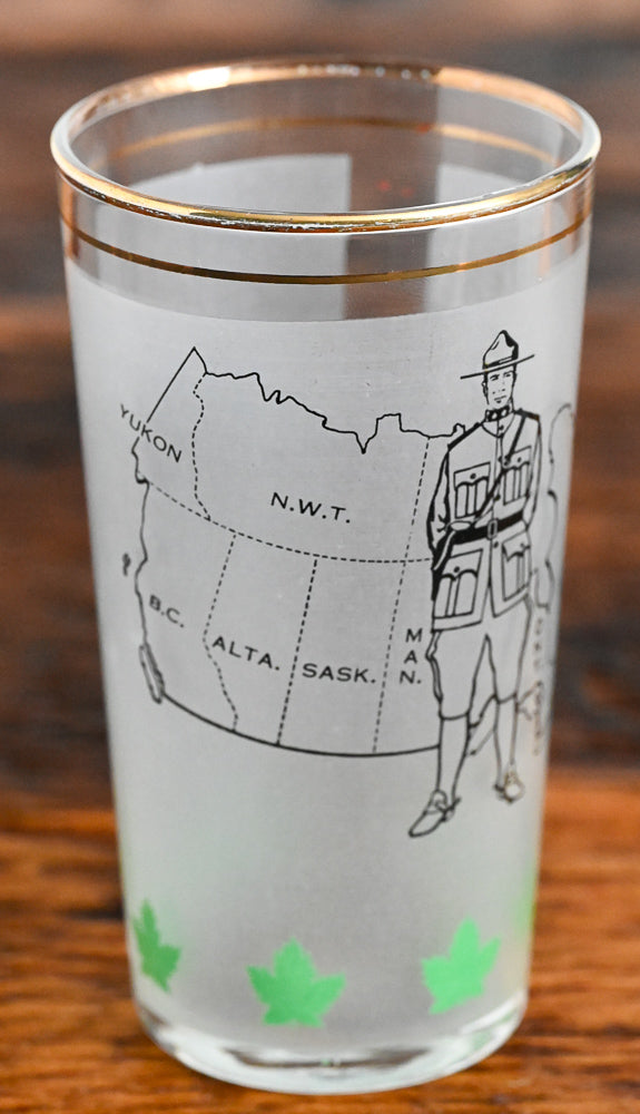 frosted tumbler with Candian Mountie and Canada Map