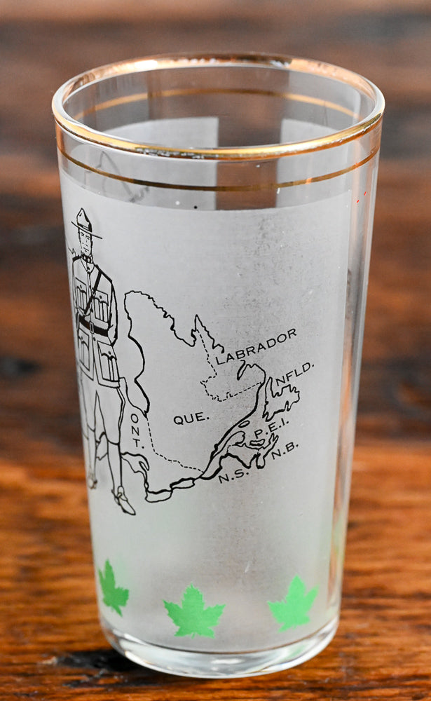 frosted tumbler with Candian Mountie and Canada Map
