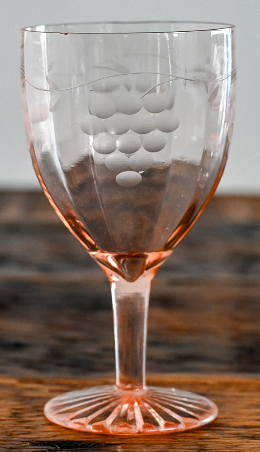 pink wine glass etched with grapes