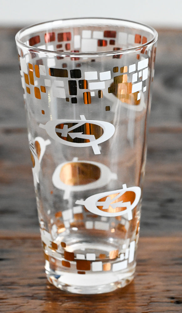 white and gold logo highball glasses